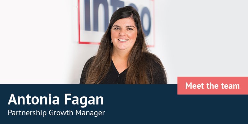 Antonia Fagan standing in front of Infigo logo