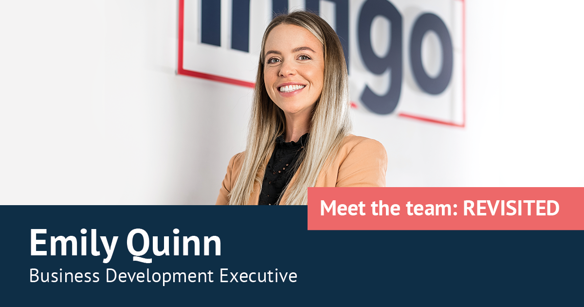 Emily Fox standing in front of Infigo Logo