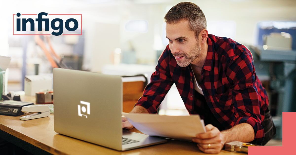 Print Service Provider working excitedly on laptop